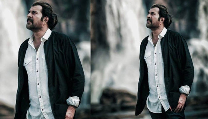   ഇത് കണ്ട് ദുല്‍ഖറിന്റെ മോള്‍ കൊച്ചാപ്പ എന്ന് വിളിക്കേണ്ടി  വരുമല്ലോ; അതിരപ്പളളി വെളളച്ചാട്ടത്തിനു മുന്നില്‍ മുടി നീട്ടി വളര്‍ത്തി സ്‌റ്റൈലന്‍ ഗെറ്റപ്പില്‍ മെഗാസ്റ്റാര്‍; പതിനെട്ടാം പടിയിലെ മമ്മൂക്കയുടെ മാസ് ലുക്ക് വൈറലാകുന്നു